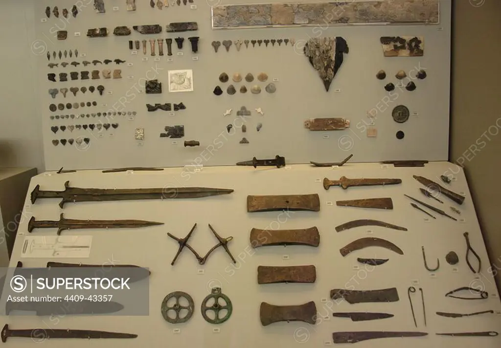 Prehistoric Art. Age of Metals. Greece. Different types of knives, axes and various utensils. National Archaeological Museum. Athens.