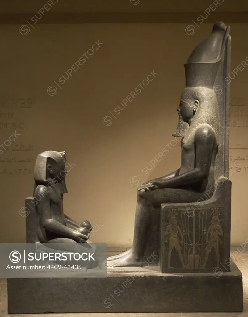 Egyptian Art. Horemheb. Last Pharaoh of 18th Dynasty. New Kingdom. Ruled from 1323 to 1295 BC. Horemheb offerer kneeling before the god Atum. Luxor Museum. Egypt.