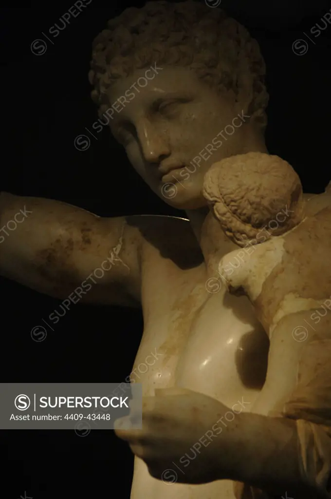 Greek Art. Second Classicism. 4th century. Greece. Hermes and the infant Dionysus. Sculpture by Praxiteles (390-335 BC) between 340-330 BC. Marble of Paros. Detail. Discovered during the excavations of the temple of Hera in 1877 at Olympia. Archaeological Museum of Olympia. Greece.