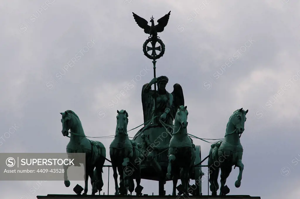 Quadriga, chariot drawn by four horses driven by Victoria Goddess. Copy by the original of 1793, by Johann Gottfried Schadow (1764-1850). Brandenburg Gate. Berlin. Germany.