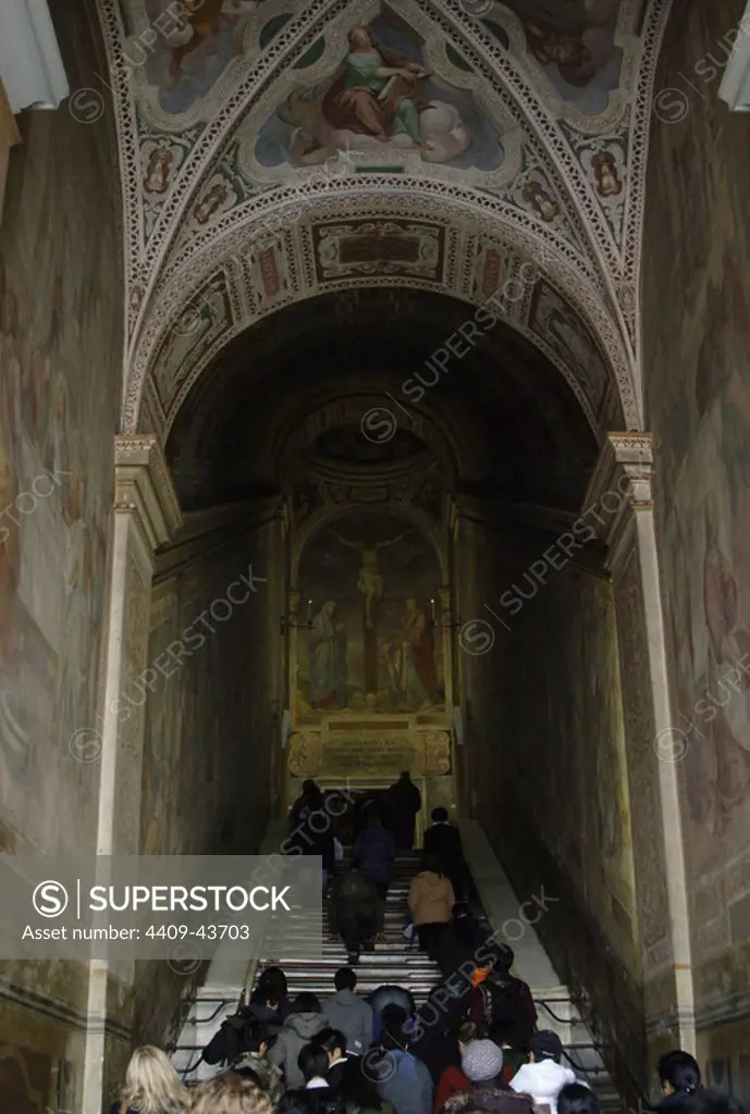 Pilgrims going up for the Holy Stairs kneeling. Rome. Italy.