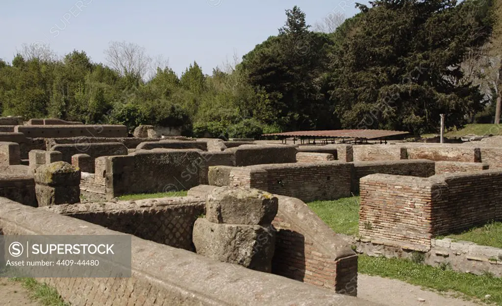 Italy. Ostia Antica. The Republican Store-building was in reality probably a complex of shops and workshops. The walls were erected at the end of the 1st century BC in opus quasi reticulatum. General view from the south-east with the tufa piers of the original southern portico.