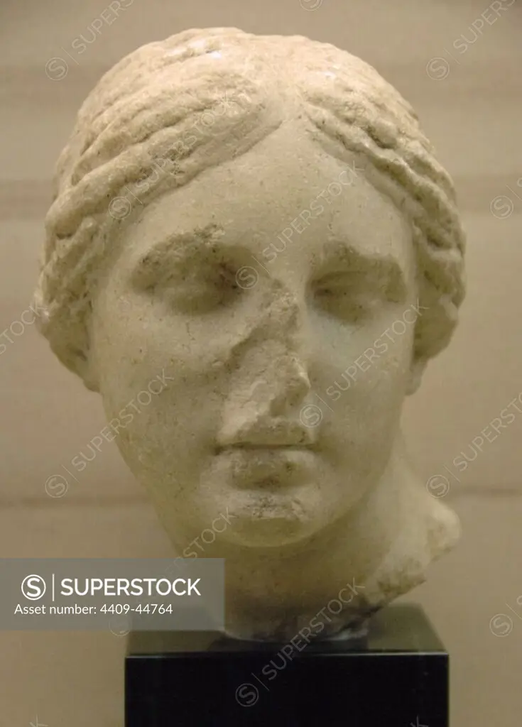 Greek Art. 4th century B.C. Marble head of Aphrodite influenced by the style of the sculptor Praxiteles. Archaeological Museum of Olympia. Greece.