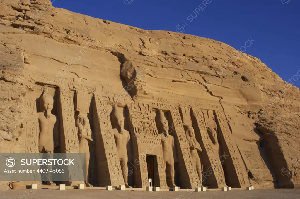 Egyptian art. Temple of Hathor or Small Temple dedicated to Nefertari. Facade depicting the pharaoh Ramses II (1290-1224 BC) and his wife Queen Nefertari dressed as Hathor. 19th dynasty. New Kingdom. Abu Simbel. Egypt.