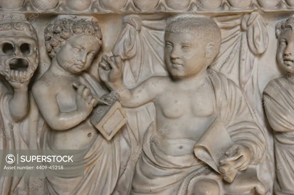 Roman Art. Relief of sarcophagus. Child and tutor writing on wax tablet with a Styli. Vatican Museum. City of the Vatican.