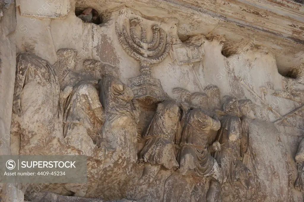 Roman Art. Arch of Titus. Triumphal arch, with a single arched, located on the Via Sacra. South-East of the Forum. It was constructed by the emperor Domitian commemorating the capture and sack of Jerusalem in 70 (Jewish war). Detail from the arch of Titus showing spoil from the sack of Jerusalem. Rome. Italy. Europe.