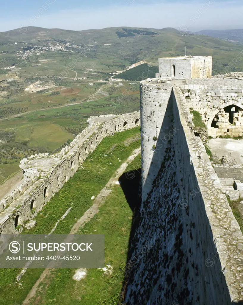 Krak des Chevaliers, Crusader castle. Built by knights Hospitaller (second castle), 1142-1170. View of walls. Syria. Photo before Syrian Civil War.