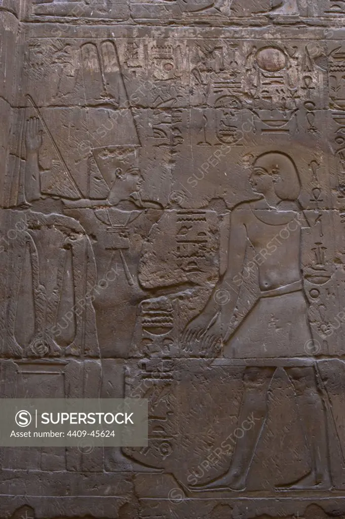 Relief depicting a pharaoh before MIN, god of fertility, represented with erect phallus. Chapel dedicated to Amun-Min. New Empire. Temple of Luxor. Egypt.