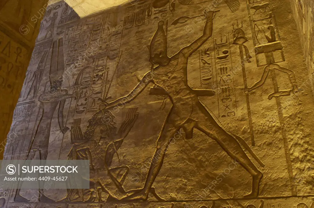Egyptian art. Great Temple of Ramses II. 19th Dynasty. The pharaoh Ramses II offering war prisoners to god Amun. 19th Dynasty. New Kingdom. Abu Simbel. Egypt.