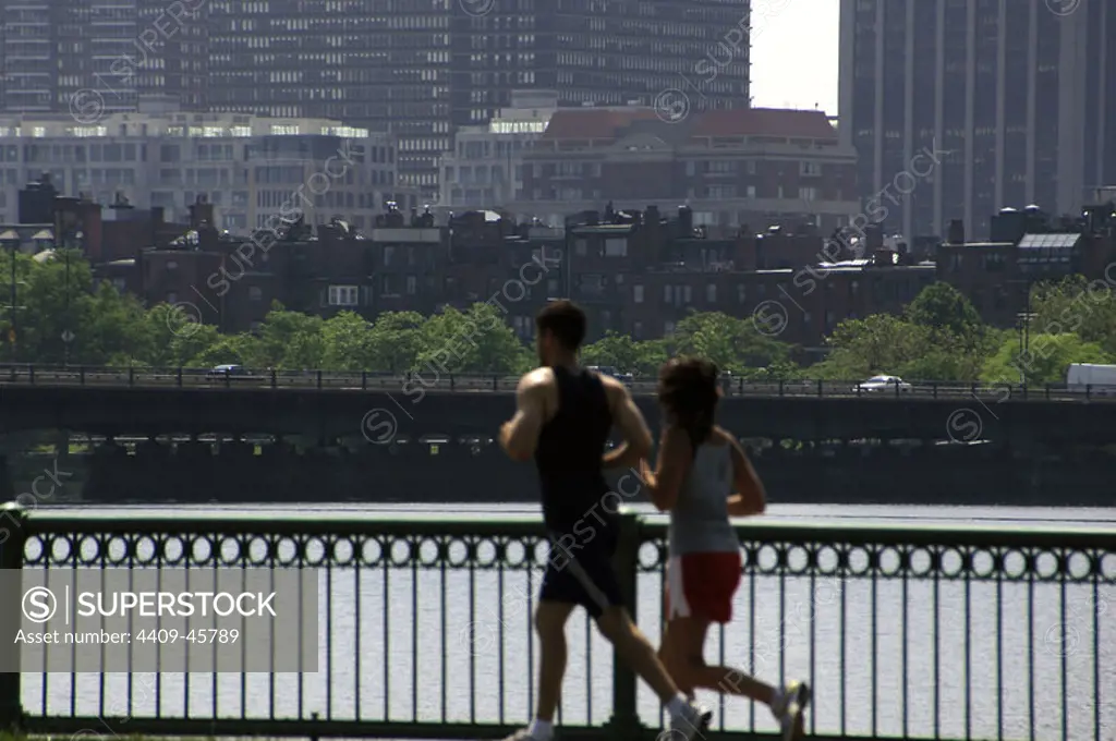 Couple jogging along the Charles River. Boston. State of Massachusetts. The United States.