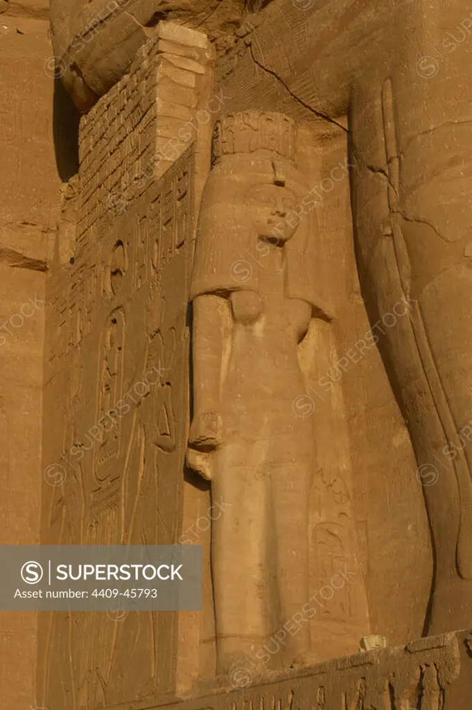 Egyptian Art. Temple of Ramses II (1290-1224 BC). Nefertari. Statue near the feet of the colossi of Ramses II. 19th dynasty. New Kingdom. Abu Simbel. Egypt.
