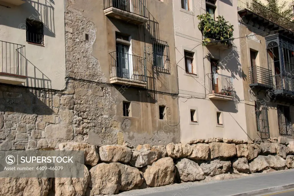 Spain. Catalonia. Tarragona. Houses in the old town. At the botton, the remains of the roman cyclopean wall.