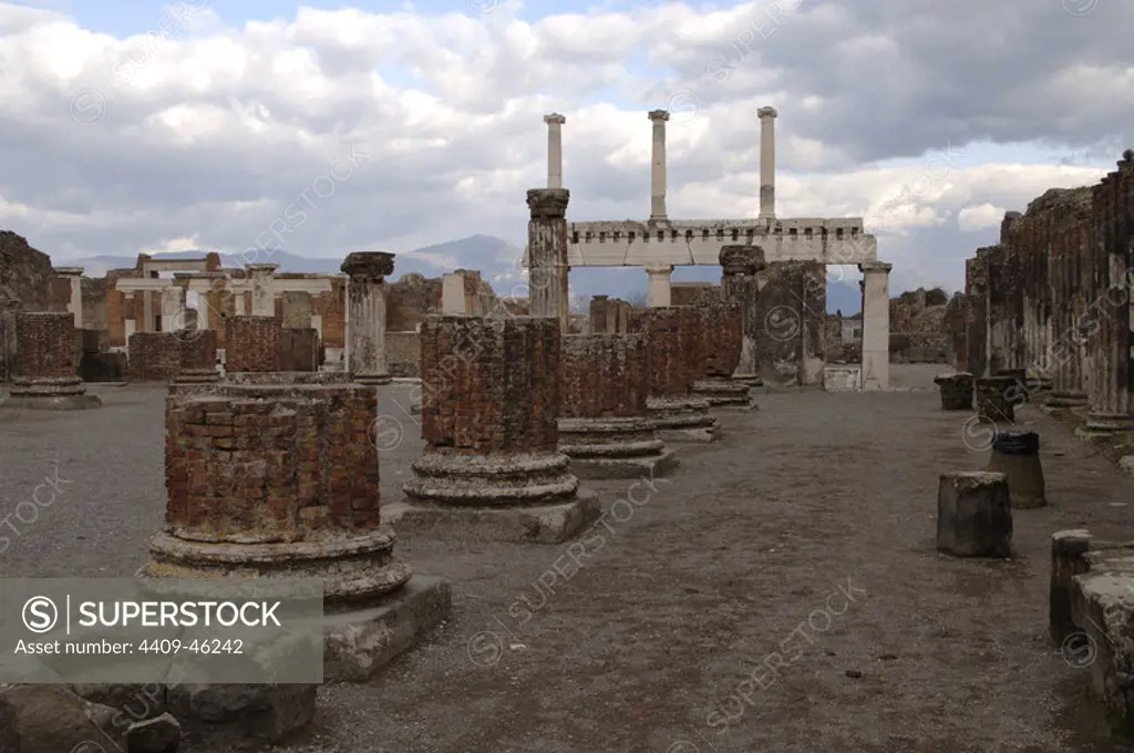 Italy. Pompeii. Ruins of the Basilica (late 2nd century BC). In the background, colonnade of forum.