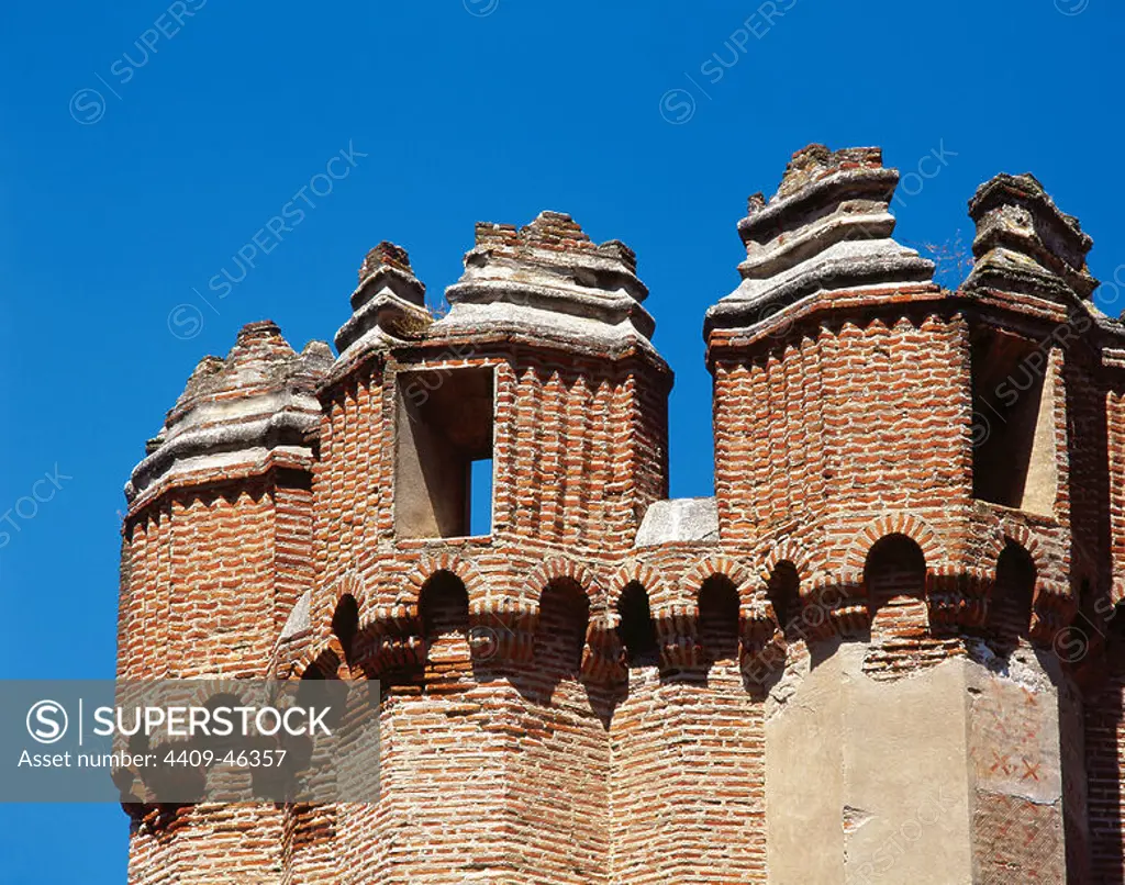 Spain. Castile-Leon. Coca Castle.15th century. Mudejar style. Exterior. Detail. Battlements of a tower.
