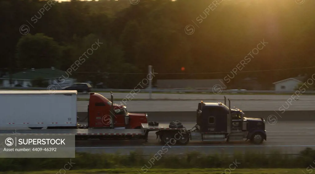 Trucks driving along the motorway. USA.