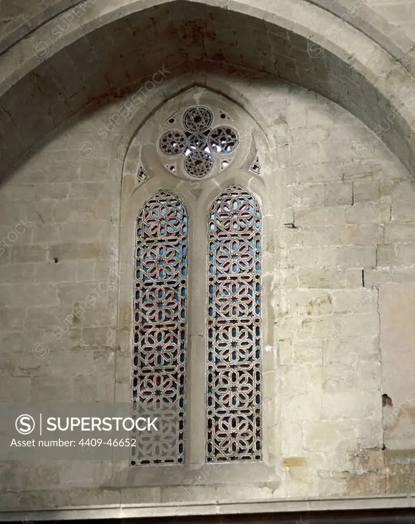 Gothic art. Cathedral of Santo Domingo de la Calzada. Pointed arch window decorated with Arabic influence, located near the entrance to the cloister. La Rioja. Spain.