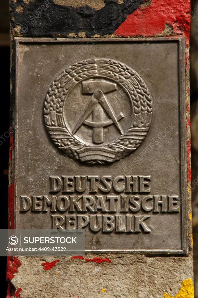 Germany. Berlin. The National Emblem of the German Democratic Republic. A hammer and a compass, surrounded by a ring of rye.