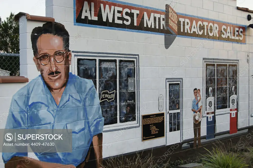 History of the United States, 20th century. Mural depicting Al West, mayor of Cuba (1946-1958) during whose tenure modernized the town by installing street lighting, attracting factories and creating jobs. Detail. Series of murals depicting historical scenes of both local and national themes. Cuba, State of Missouri, United States.