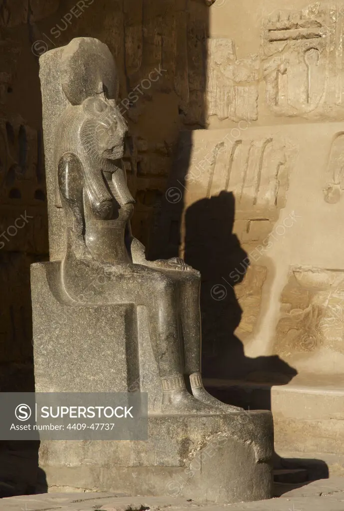 Goddess Sekhmet, goddess of war, represented with head of a lioness and the human body and crowned with the solar disk. Sculpture in the mortuary temple of Ramses III (1187-1156 BC). New Kingdom. Medinet Habu. Egypt.