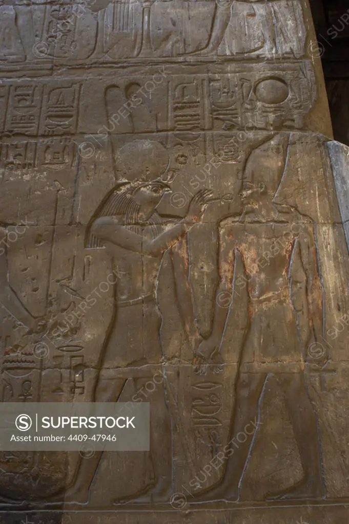 Relief depicting the god Monthu offering the ankh to the pharaoh. New Empire. Temple of Luxor. Egypt.