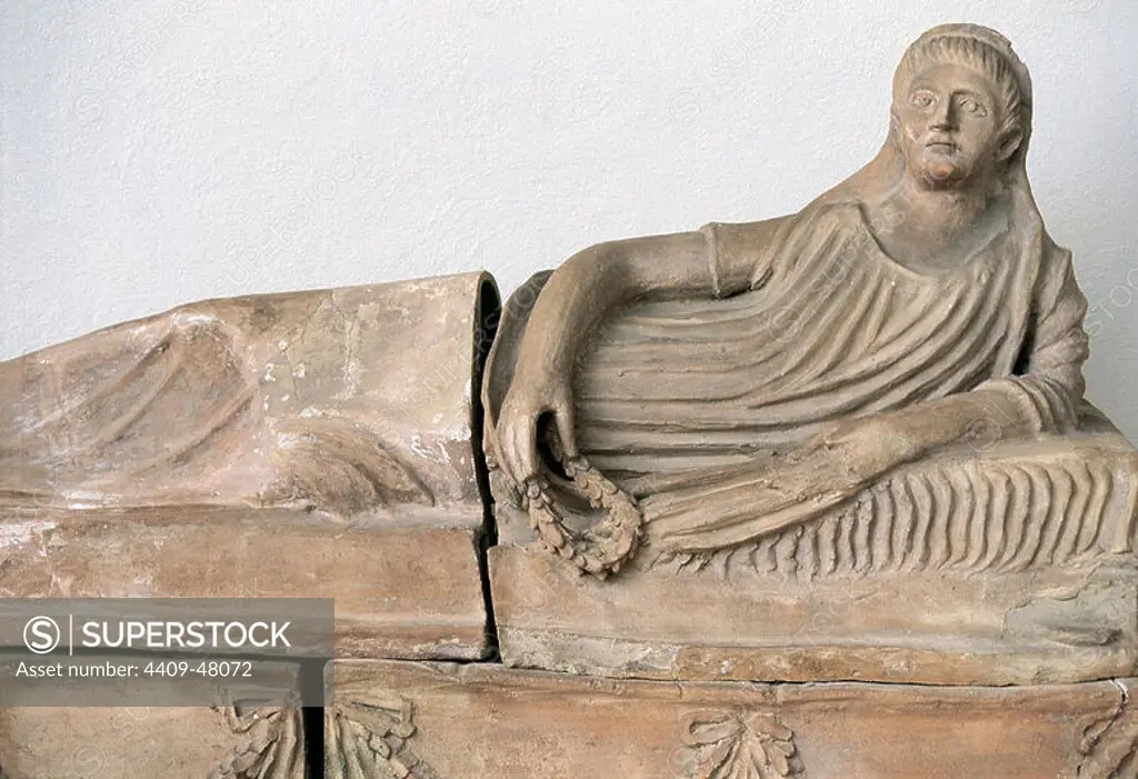Etruscan sarcophagus depicting a female deceased reclining carrying a laurel wreath on her hand. 4th-3rd century BC. Vitelleschi Palace. National Archaeological Museum of Tarquinia. Italy.