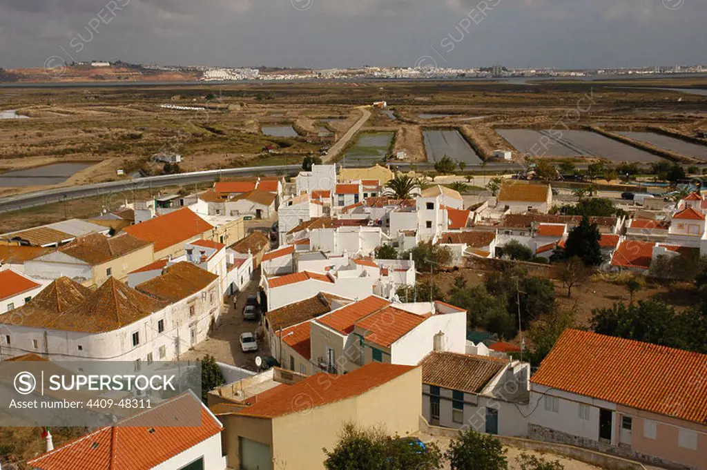 Portugal. Castro Marim. Overview with the salt evaporation ponds. In the background, the town of Ayamonte (Andalusia, Spain). Algarve.