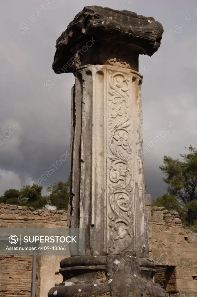 Greek Art. Phidias Workshop ruins, built in 430 BC to house the statue of Zeus. In the fifth century, Theodosius II turned the building into an early Christian church. Column with relief on the shaft. Olympia. Greece.