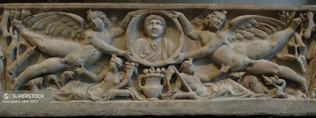 Roman Art. Marble sarcophagus with flying erotes holding a clipeus portrait. At the bottom, the Earth and the Ocean. Dated between 190-200. Severan period. Metropolitan Museum of Art. New York. United States.