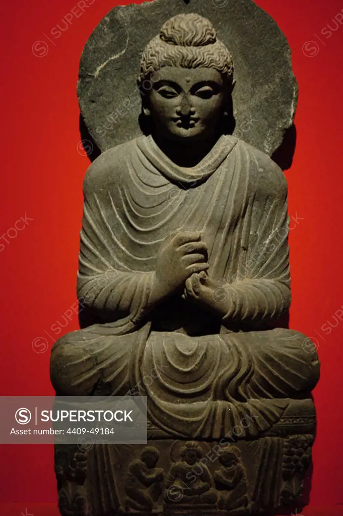 Buddha statue with dharmachakra mudra gesture. Gandhara. 2nd-3rd centuries AD. Pergamon Museum. Berlin. Germany.