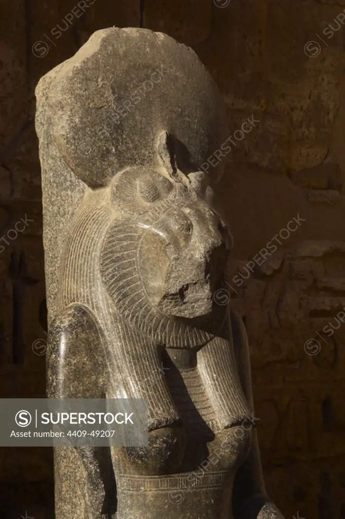 Goddess Sekhmet, goddess of war, represented with head of a lioness and the human body and crowned with the solar disk. Detail. Sculpture in the mortuary temple of Ramses III (1187-1156 BC). New Kingdom. Medinet Habu. Egypt.