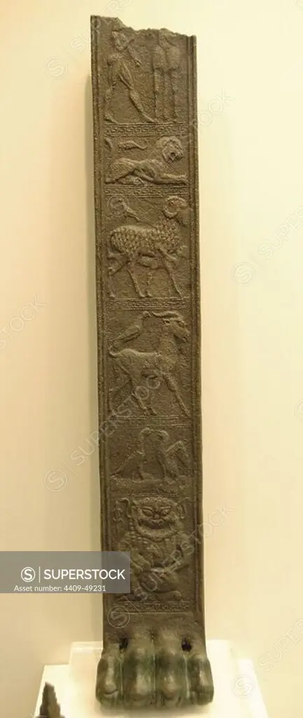 Greek Art. Archaic Age. 6th century BCE. Bronze tripod foot with six reliefs depicting: 1-Woman holding a horse by the reins, 2 - Lion and Scorpion, 3 - Odysseus escapes the Cyclops hidden under a ram, 4 - Goat and Bird, 5 - Two faced fighting birds, 6 - Pegasus Gorgon with her son. Archaeological Museum of Olympia. Greece.