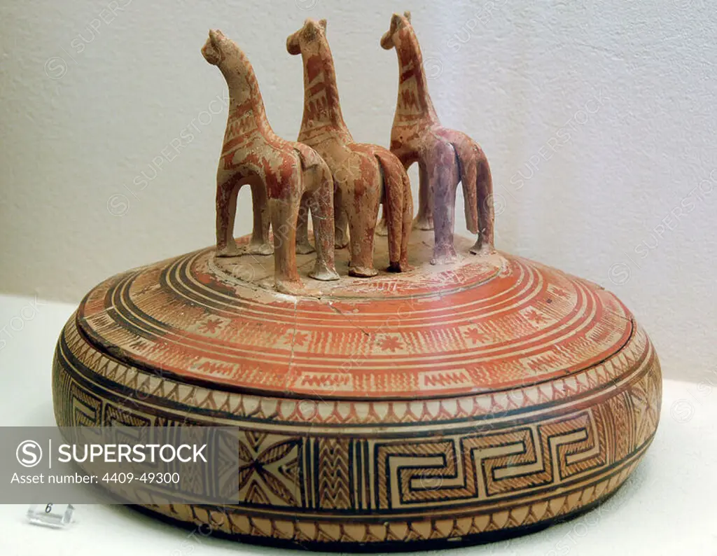 Greek Art. Geometric perios. Pyxis decorated with geometric motifs and lid topped with figures of horses. Greece. Kerameikos Museum. Athens.