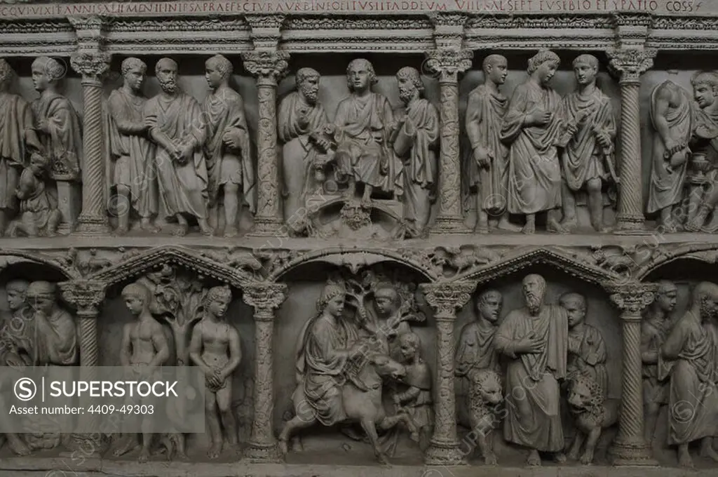 Cast of the Sarcophagus of Junius Bassus. Upper register: Sacrifice of Isaac, Peter taken prisoner, Christ enthroned on the personification of Heaven between Peter and Paul, Christ taken before Pilate. Lower register: The patient Job with his wife and friend, The Original Sin, Entry of Jesus into Jerusalem and Daniel in the Lion's den. 359 AD. Carrara Marble. Found in Rome. Treasury of Saint Peter's Museum. Vatican City.