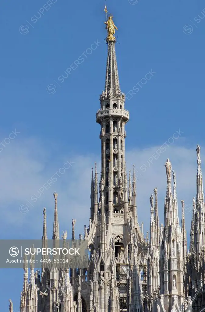 Italy. Milan Cathedral. Spire by Francesco Croce, with the Madonnina (Virgin Mary), baroque gilded bronze statue by Giuseppe Perego. 18th century.