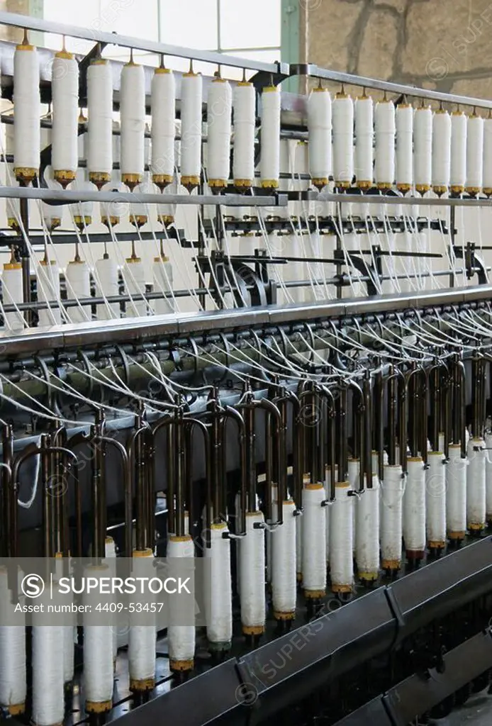 Textile industry. Machine used in the spinning process to prepare uniform wicks, weight loss, twisting them and then pass them to Jenny. Colonia Vidal. Founded in 1898 by Ignasi Vidal, on the right bank of the river Llobregat. Puig-Reig. Catalonia. Spain.