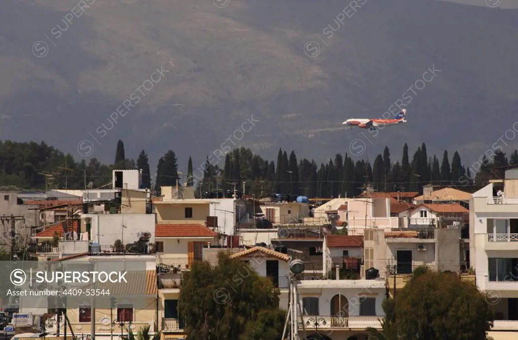 Greece. Zante (Zakynthos). Partial view and an aeroplane overflying the city. Island of Zante. Ionian Islands.