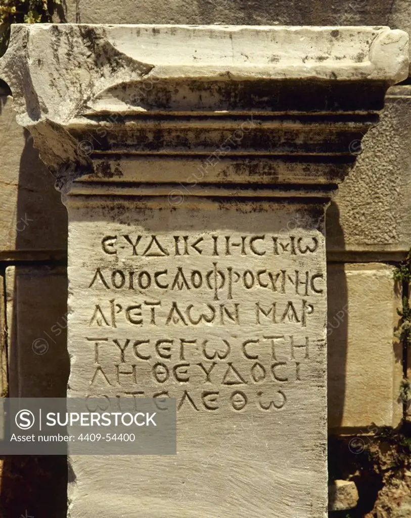 Greek inscription engraved on a marble slab. Via of the Curetos. Ephesus city. Turkey.