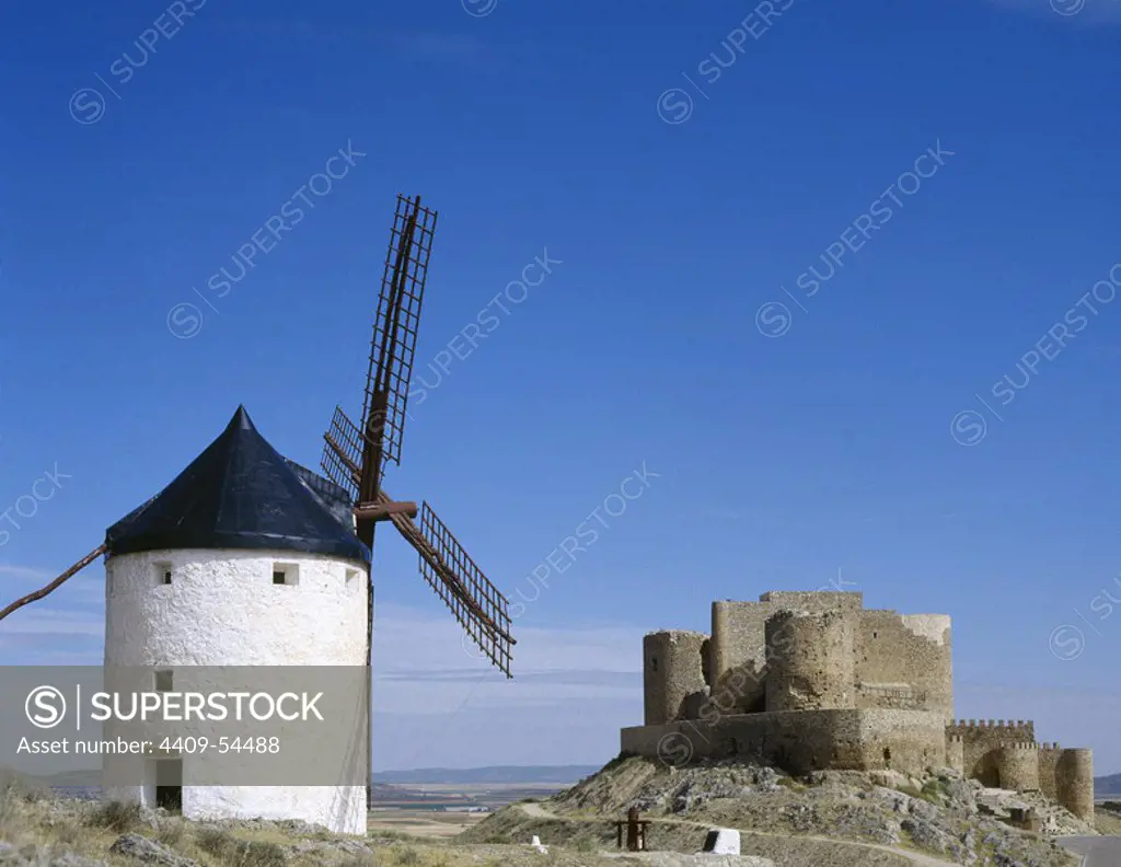 Spain, Castile-La Mancha, Toledo province. Consuegra. View of the Castle (stronghold of Knights of San Juan) and a windmill.