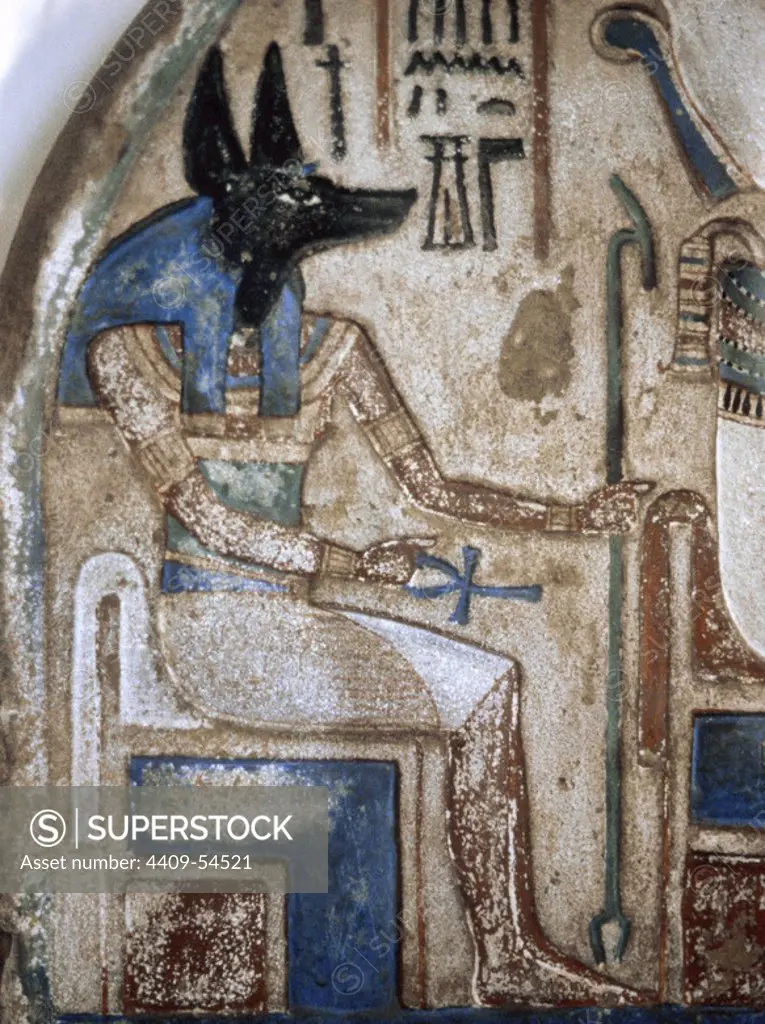 Stele of Nanai. Detail with depiction of the god Anubis. Late 18th Dynasty. New Kingdom of Egypt. Calcareous and polychrome stone. The Egyptian Museum of Turin, Italy.