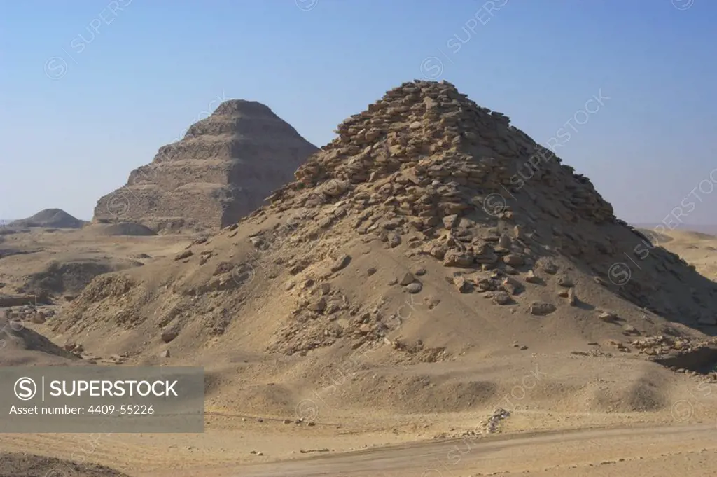 Pyramid of Userkaf. At background, Djoser Pyramid. Old kingdom. Saqqara. Egypt.