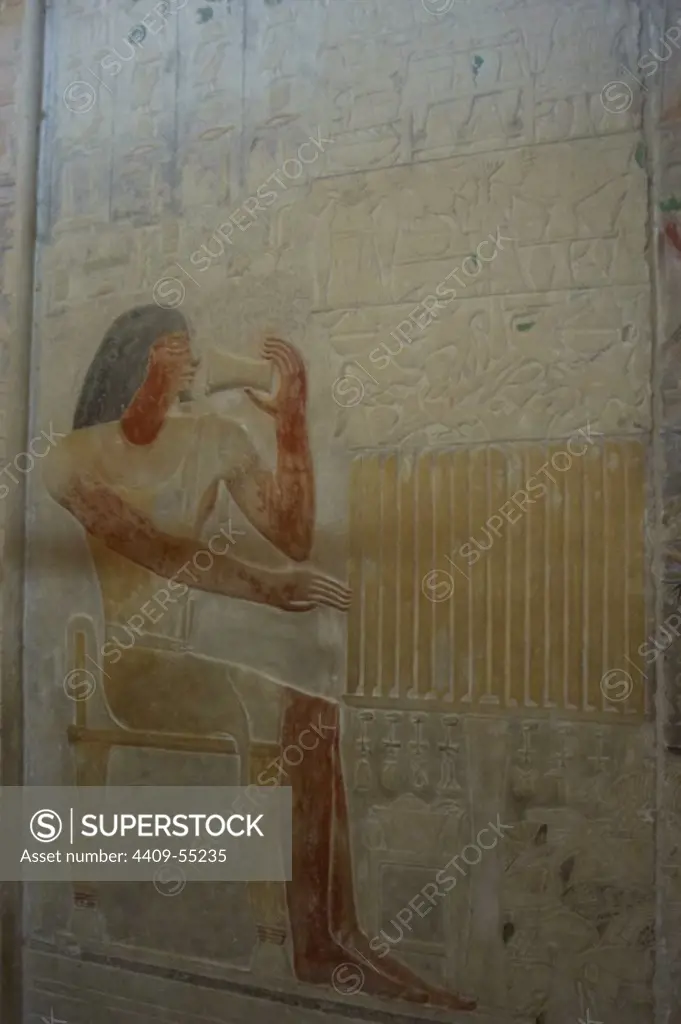 Mastaba of Ptahhotep and Akhethotep. Egyptian viziers. Father and son. Relief depicting Ptahhotep with a glass with a ointment that smells her regenerator perfume. Saqqara. Egypt.