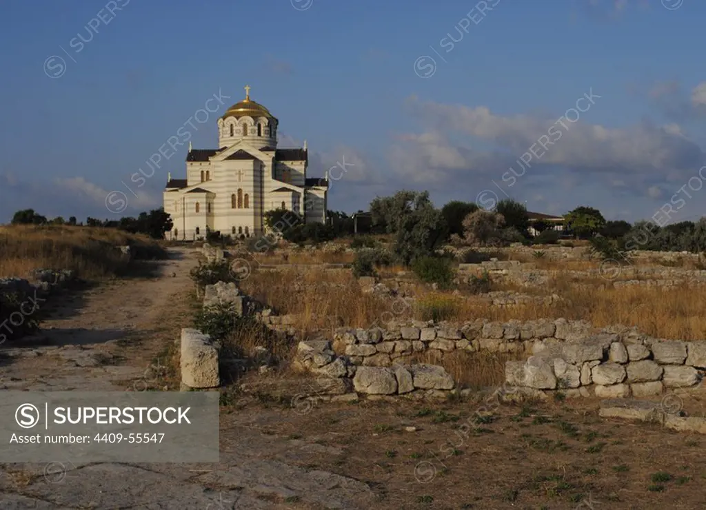 Ukraine. Ruins of greek colony Chersonesus Taurica. 6th century BC. At background, Neo-Byzantine Russian Orthodox Church reconstructed at 21th century by E. Osadchiy. Sevastopol.