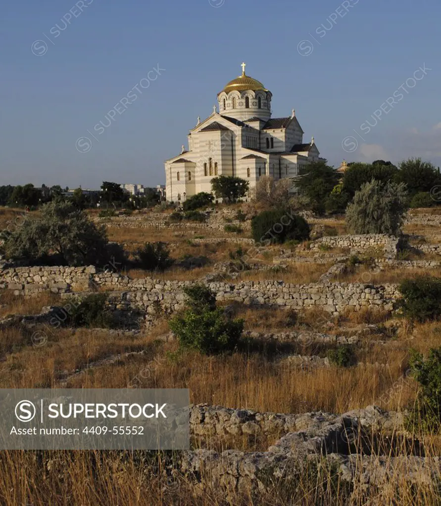 Ukraine. Ruins of greek colony Chersonesus Taurica. 6th century BC. At background, Neo-Byzantine Russian Orthodox Church reconstructed at 21th century by E. Osadchiy. Sevastopol.
