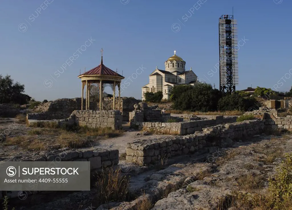 Ukraine. Ruins of greek colony Chersonesus Taurica. 6th century BC. At background, Neo-Byzantine Russian Orthodox Church reconstructed at 21th century by E. Osadchiy. First, the supposed spot of christening of Prince Vladimir the Great. Sevastopol.