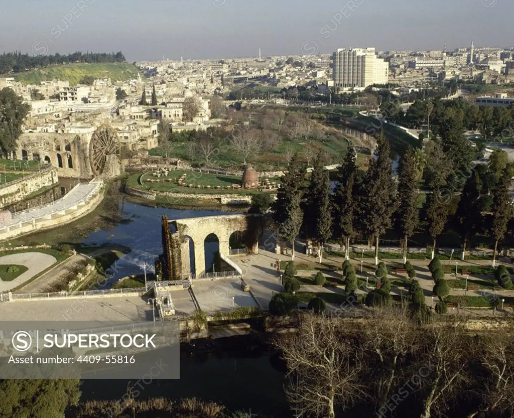 Syria. Hama. General view and the noria in the Orontes river.