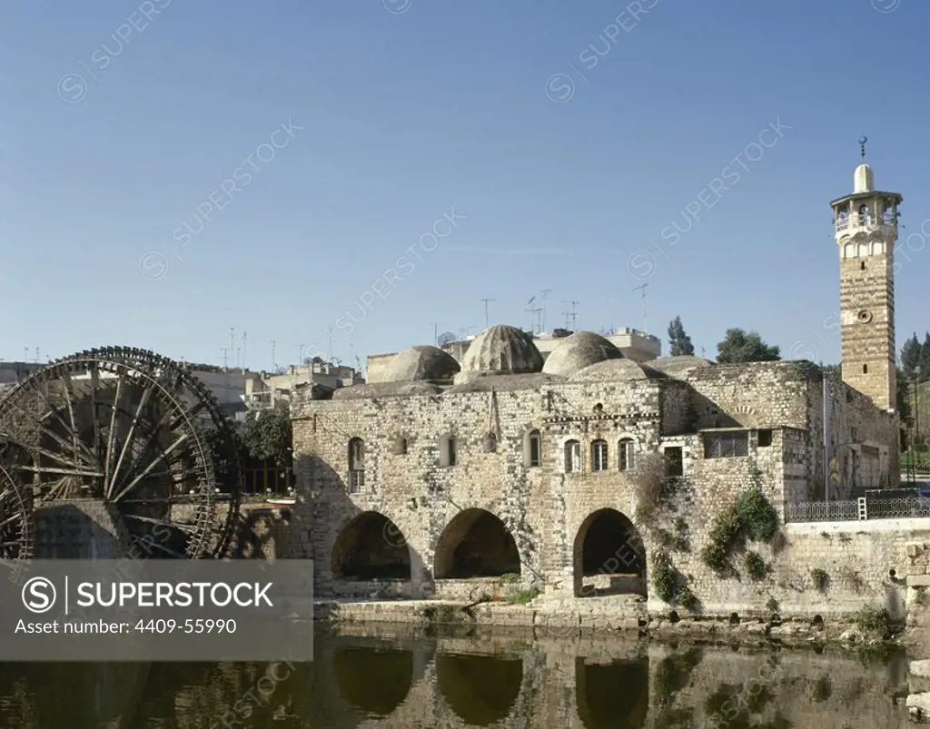 Syria. Hama. An-Nuri Mosque, built by Nur Al-Din. 12th century. On the left, medieval noria near the Orontes river.