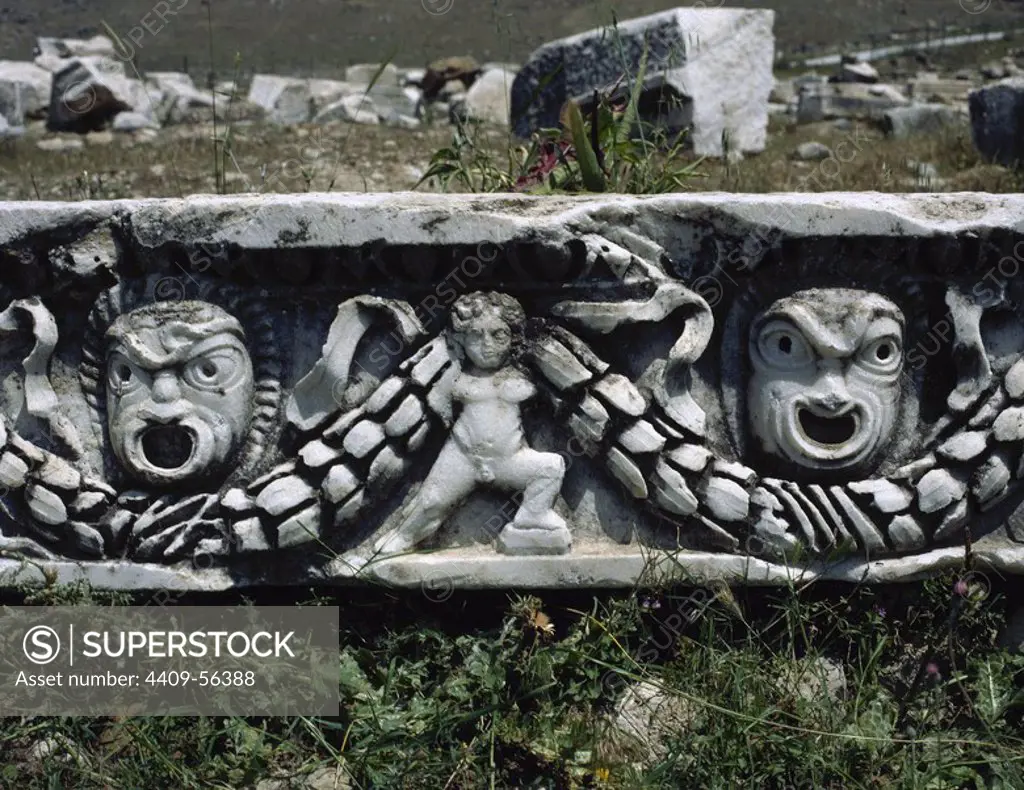 Hierapolis. Ancient city in classical Phrygia, Anatolia. Depiction of theatrical masks and cupid holding a garland. Remains of the theater frieze, built in the 2nd century. Turkey.