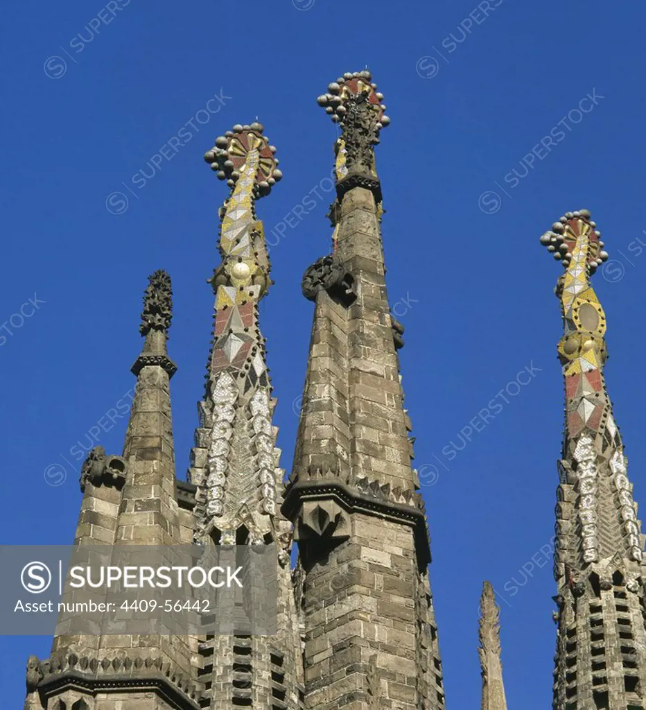 Spain, Catalonia, Barcelona. Basilica of The Sagrada Familia, by Antonio Gaudi (1852-1926). Pinnacles of the towers of the apostles, decorated with technique of "Trencadis", broken tiles mosaics. Architectural detail. Catalan Modernism style. Unesco World Heritage Site.