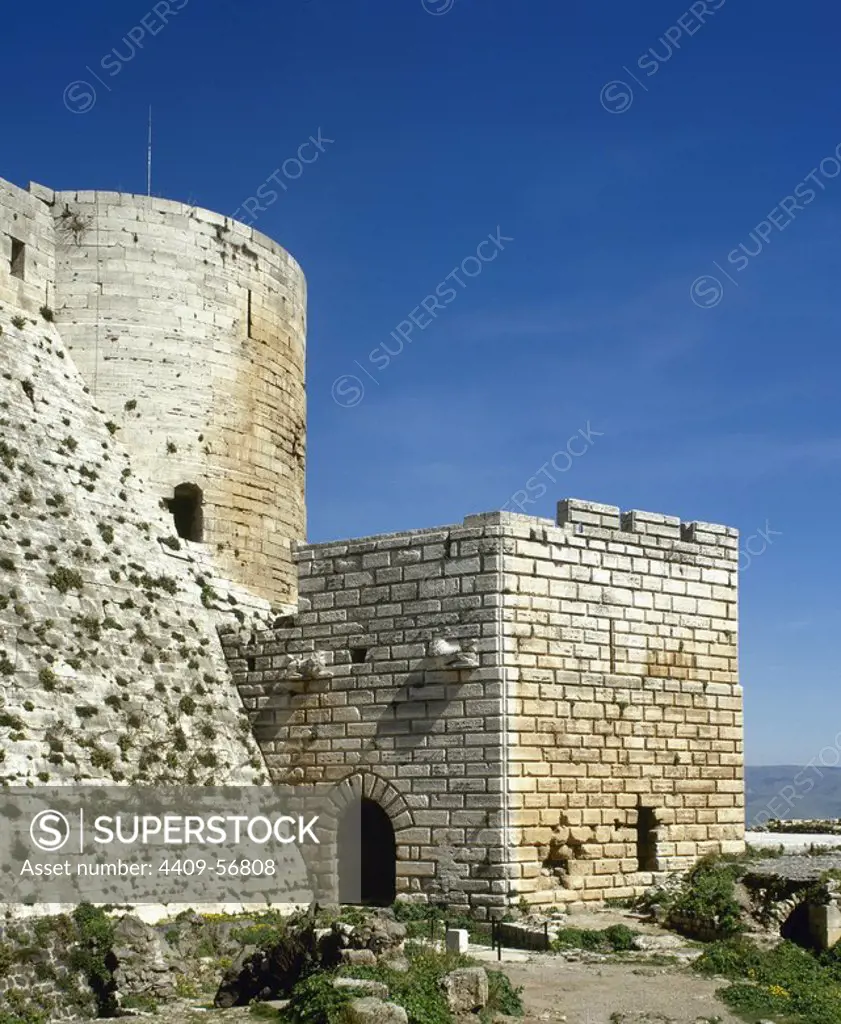 Syria Arab Republic. Krak des Chevaliers. Crusader castle, under control of Knights Hospitaller (1142-1271) during the Crusades to the Holy Land, fell into Arab control in the 13th century. Partial view of the walls. Photo taken before the Syrian Civil War.
