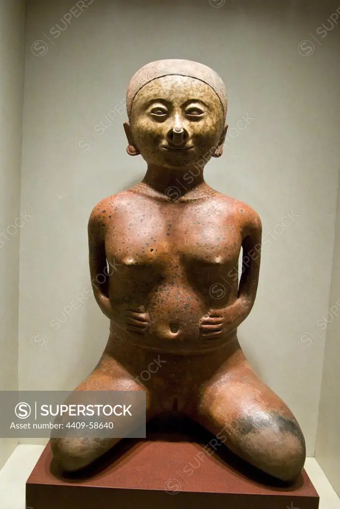 Mexico.Mexico city.National Museum of Antropology. Nayarit culture.Las Cebollas (200BC-600AC).Female figure in ceramic.Representation of a woman giving birth..